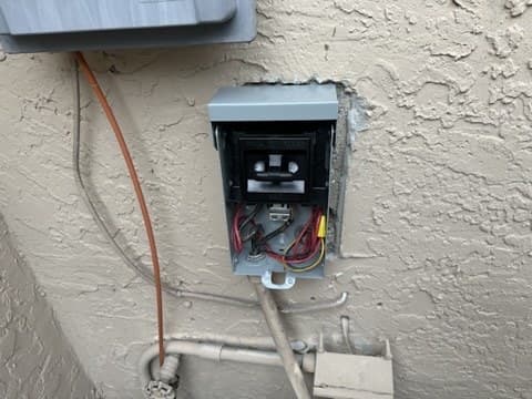 AC disconnect box opened for an electrical diagnostic at a Miami-Dade home